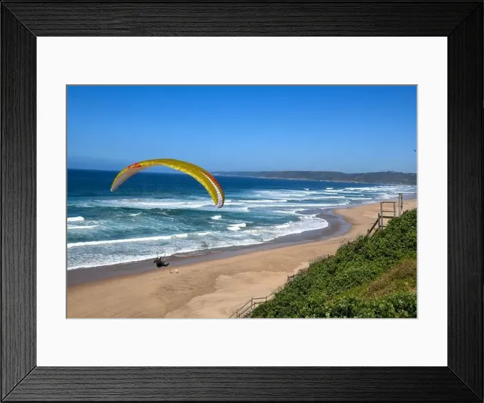 Framed Print : Person flying his paraglider on the beach of Wilderness in South Africa Framed Print : Person flying his paraglider on the beach of Wilderness in South Africa