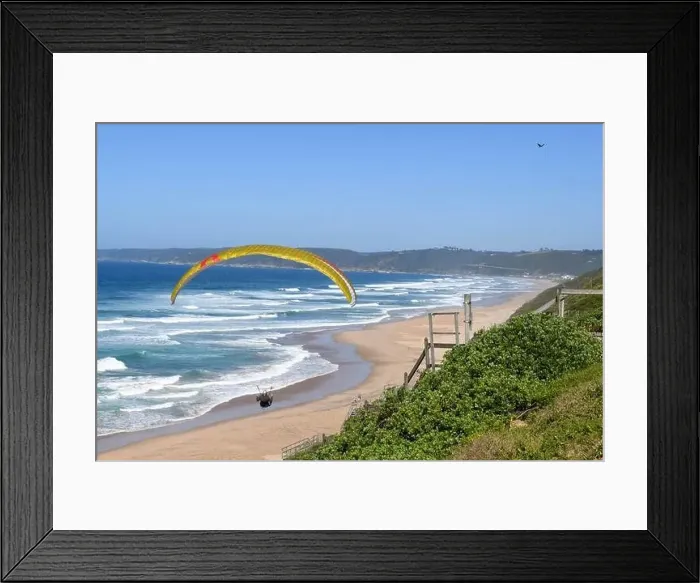 Framed Print : Person flying his paraglider on the beach of Wilderness in South Africa