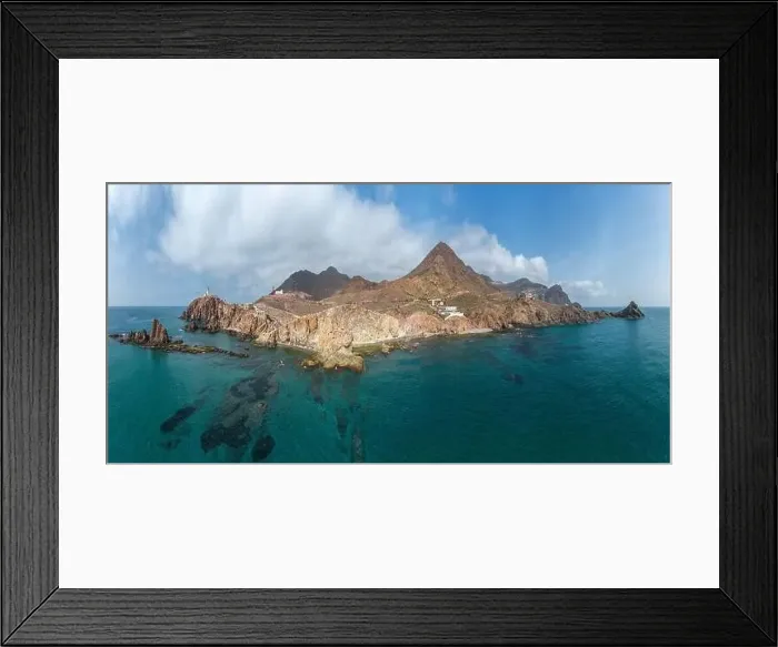 Framed Print : Drone view of lighthouse located on rough cliff near sea under cloudy sky in Almeria Framed Print : Drone view of lighthouse located on rough cliff near sea under cloudy sky in Almeria