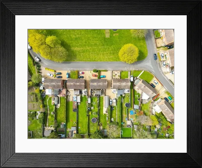 Framed Print : Drone top down view of typical English semi-detached houses showing there extended gardens Framed Print : Drone top down view of typical English semi-detached houses showing there extended gardens