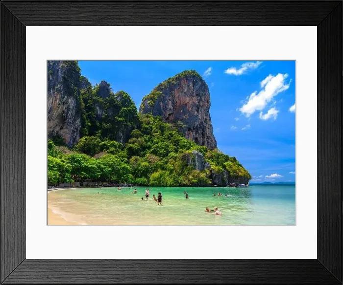 Framed Print : Rocks, water, tropical white sand beach and people swimming in emerald azure water of bay Framed Print : Rocks, water, tropical white sand beach and people swimming in emerald azure water of bay