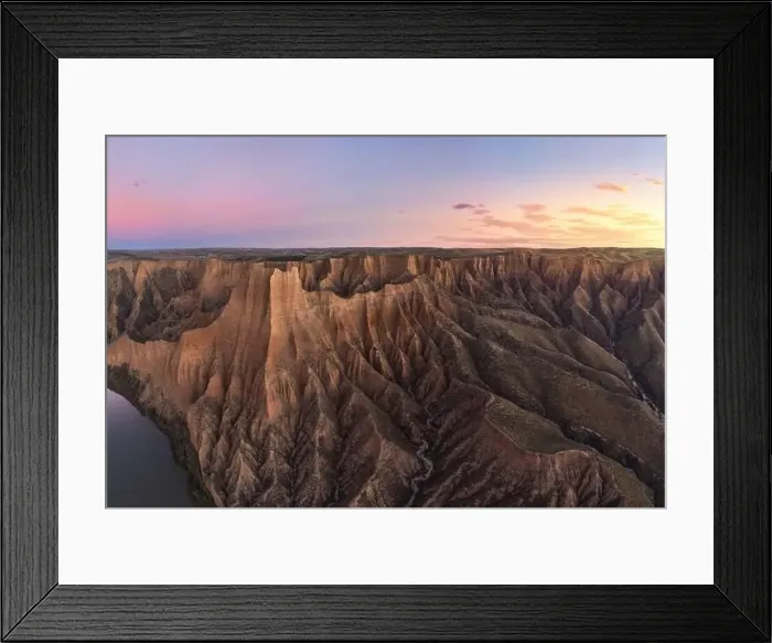 Framed Print : Aerial view of picturesque rough rocky mountains in daylight standing high next to canyon with flowing river under Framed Print : Aerial view of picturesque rough rocky mountains in daylight standing high next to canyon with flowing river under