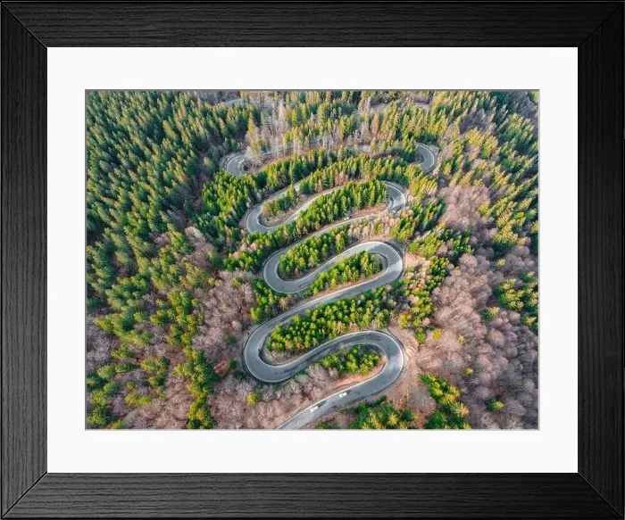 Framed Print : Aerial photography of a winding road in the mountains with serpentines and curves Framed Print : Aerial photography of a winding road in the mountains with serpentines and curves