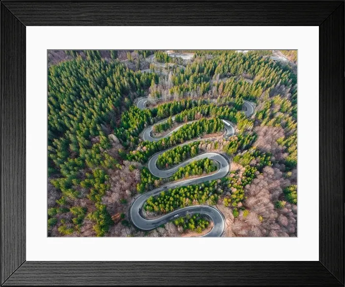 Framed Print : Aerial photography of a winding road in the mountains with serpentines and curves Framed Print : Aerial photography of a winding road in the mountains with serpentines and curves