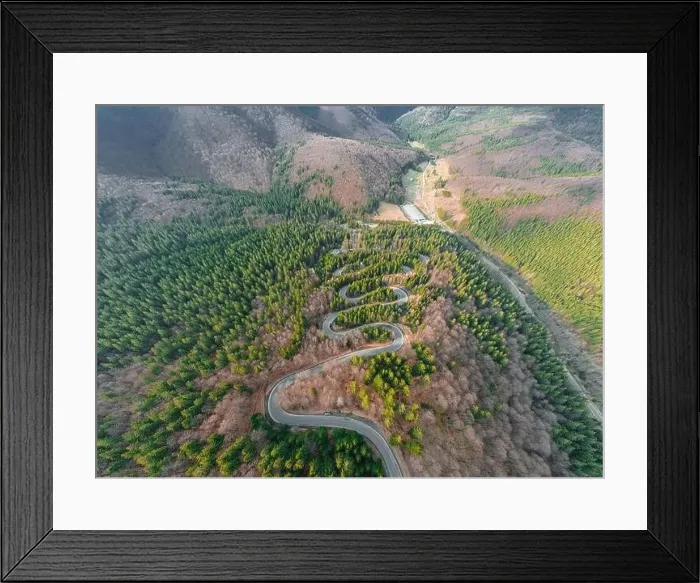 Framed Print : Aerial photography of a winding road in the mountains with serpentines and curves Framed Print : Aerial photography of a winding road in the mountains with serpentines and curves