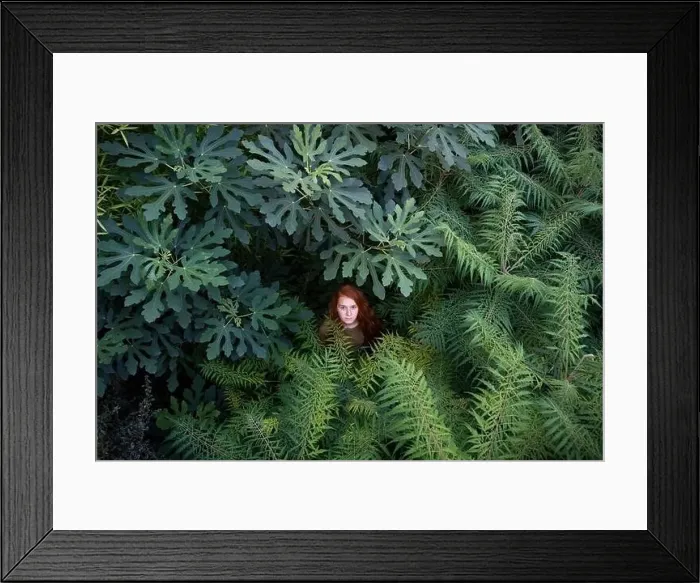 Framed Print : Girl standing amidst plants in nature Framed Print : Girl standing amidst plants in nature