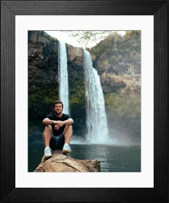 Framed Print : Man standing in front of Wailua Waterfall on Kauai Framed Print : Man standing in front of Wailua Waterfall on Kauai