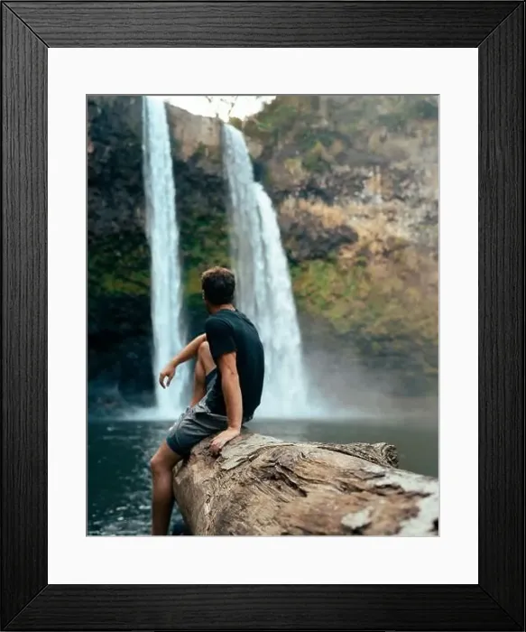 Framed Print : Man standing in front of Wailua Waterfall on Kauai Framed Print : Man standing in front of Wailua Waterfall on Kauai