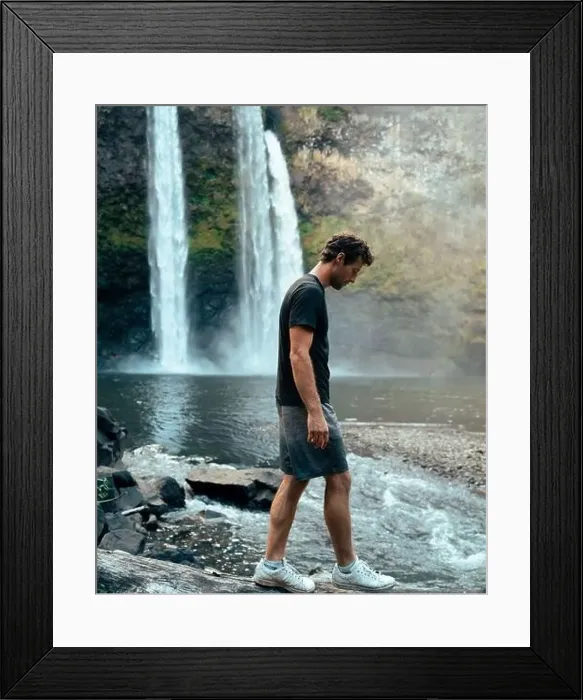 Framed Print : Man standing in front of Wailua Waterfall on Kauai Framed Print : Man standing in front of Wailua Waterfall on Kauai