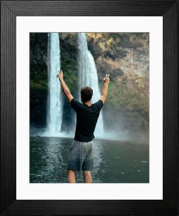 Framed Print : Man standing in front of Wailua Waterfall on Kauai Framed Print : Man standing in front of Wailua Waterfall on Kauai