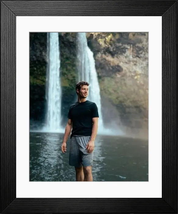 Framed Print : Man standing in front of Wailua Waterfall on Kauai Framed Print : Man standing in front of Wailua Waterfall on Kauai