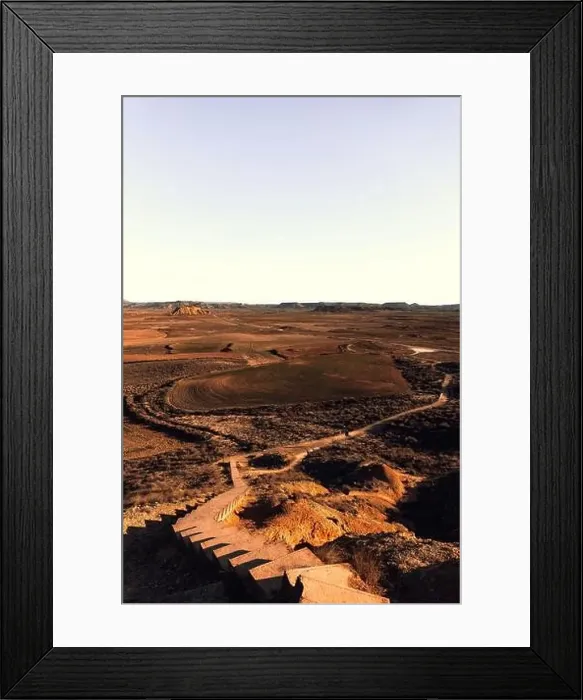 Framed Print : Aerial view of staircases running through dry desert valley with rocky formations Framed Print : Aerial view of staircases running through dry desert valley with rocky formations