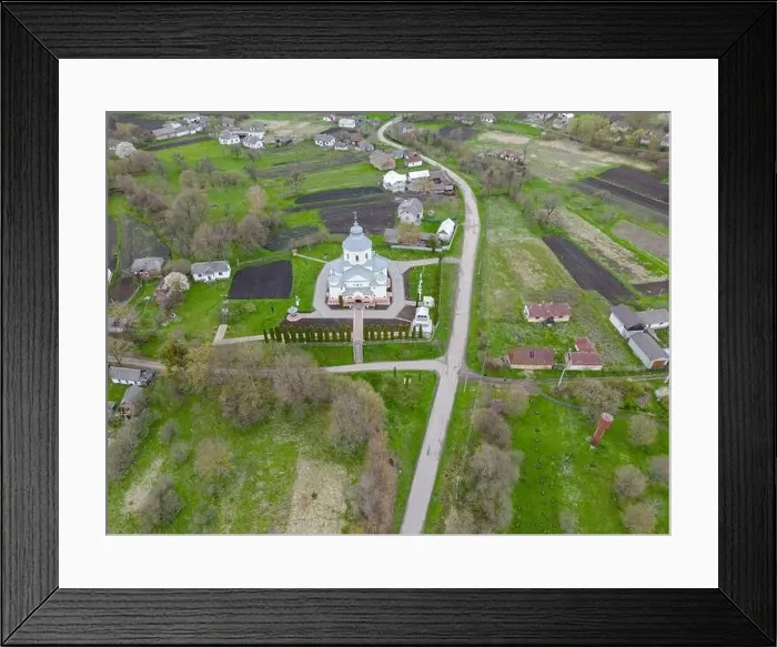 Framed Print : A bird view of charming Christian church nestled in the heart of the village. Rural spring scene Framed Print : A bird view of charming Christian church nestled in the heart of the village. Rural spring scene