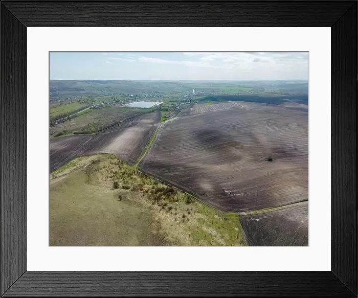 Framed Print : Top view of spring fields divided into sectors. Rural scene Framed Print : Top view of spring fields divided into sectors. Rural scene