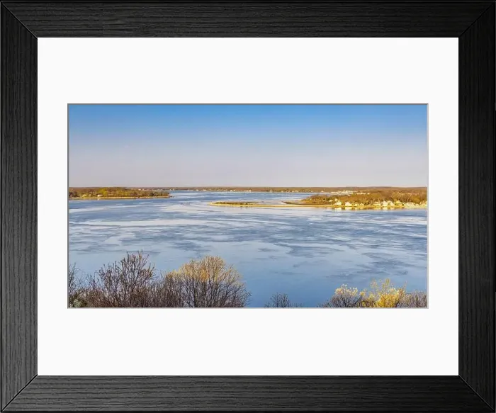 Framed Print : a spring landscape of a boat underway off quinipet camp with distant southold in the background