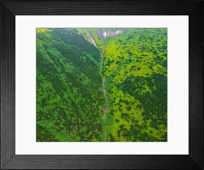 Framed Print : A small stream flowing out of the top of the Carpathian Mountains, general view from the drone. Summer mountains Framed Print : A small stream flowing out of the top of the Carpathian Mountains, general view from the drone. Summer mountains