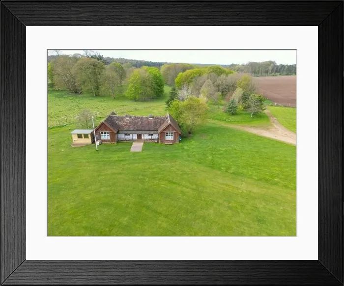 Framed Print : Drone aerial view of a mostly timber cricket pavilion seen at the edge of a lush cricket pitch Framed Print : Drone aerial view of a mostly timber cricket pavilion seen at the edge of a lush cricket pitch