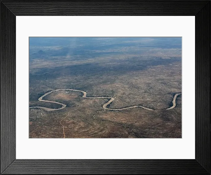 Framed Print : Aerial View of Namibia a winding road through the wilderness Framed Print : Aerial View of Namibia a winding road through the wilderness