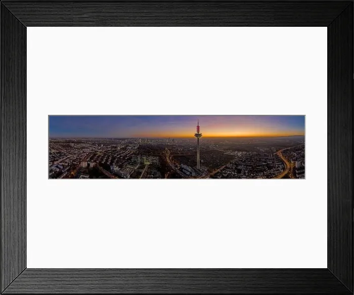 Framed Print : Panoramic drone image of the Frankfurt skyline with television tower in the evening during a colorful Framed Print : Panoramic drone image of the Frankfurt skyline with television tower in the evening during a colorful