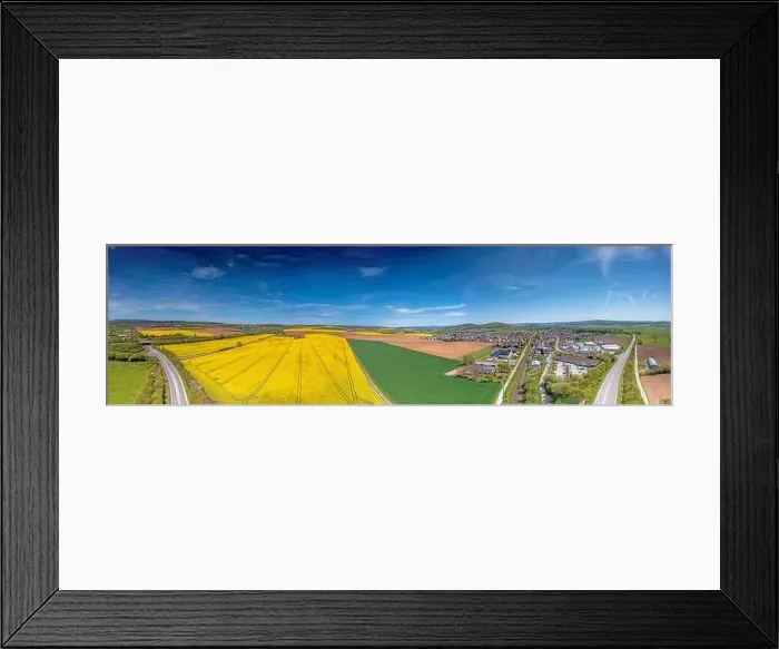 Framed Print : Aerial drone picture of rape field in spring in typical bright yellow color during daytime Framed Print : Aerial drone picture of rape field in spring in typical bright yellow color during daytime