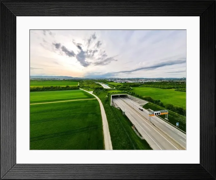 Framed Print : Aerial view of Highway with ecoduct bridge overpass for wild animals and pedestrians Framed Print : Aerial view of Highway with ecoduct bridge overpass for wild animals and pedestrians