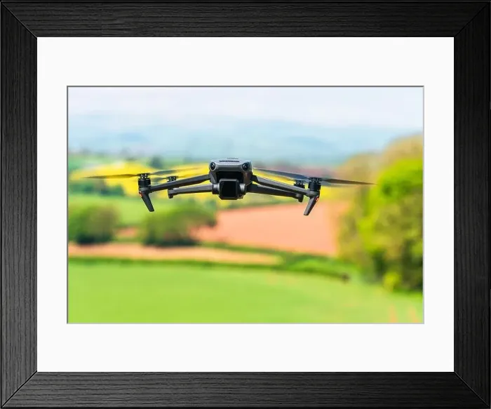 Framed Print : Drone in flight over fields and farms, Devon, England Framed Print : Drone in flight over fields and farms, Devon, England