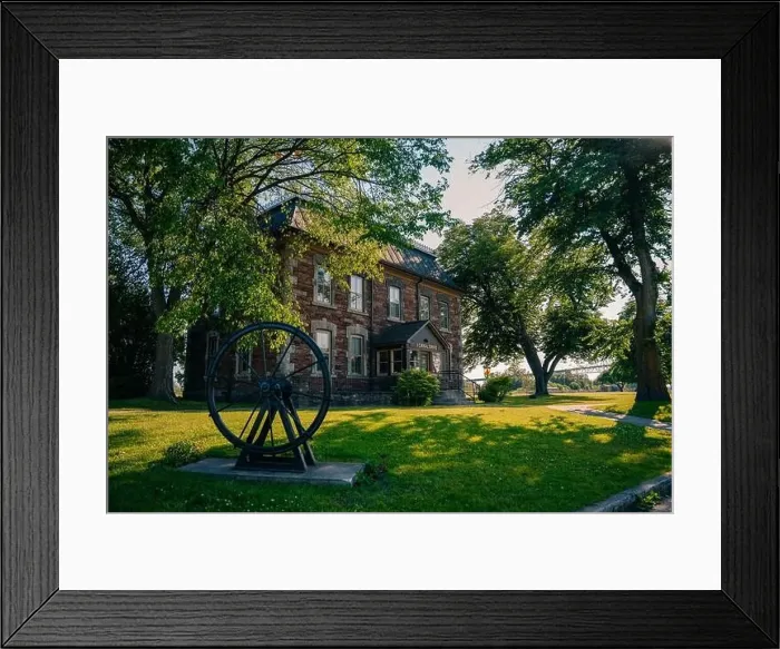 Framed Print : Sault Ste. Marie, ON, Canada-June 30, 2022 Historical building on the waterfront of the Soo Locks.. High quality photo Framed Print : Sault Ste. Marie, ON, Canada-June 30, 2022 Historical building on the waterfront of the Soo Locks.. High quality photo