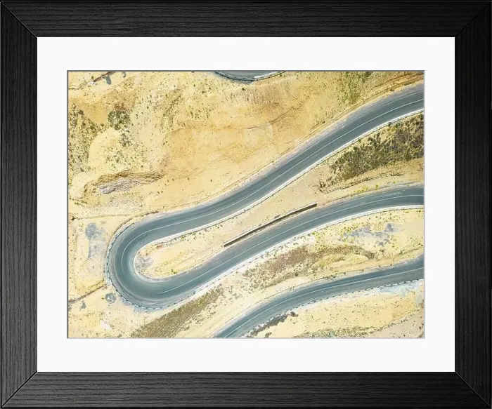Framed Print : Top aerial view of snake curved road. Winding mountains road. View from above. Driveway serpentine with cars Framed Print : Top aerial view of snake curved road. Winding mountains road. View from above. Driveway serpentine with cars