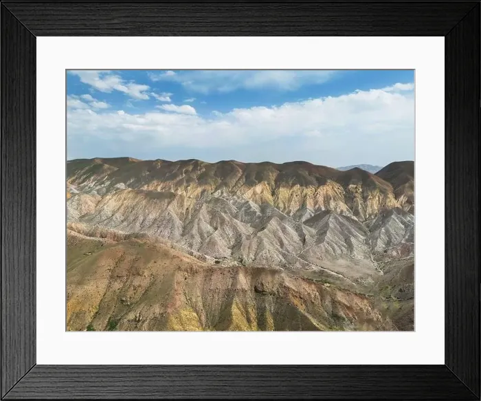 Framed Print : Aerial view mountain over blue sky. Drone view mountain valley. Beautiful view from above surface of mountain hills Framed Print : Aerial view mountain over blue sky. Drone view mountain valley. Beautiful view from above surface of mountain hills