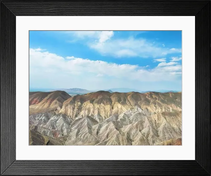 Framed Print : Aerial view mountain over blue sky. Drone view mountain valley. Beautiful view from above surface of mountain hills Framed Print : Aerial view mountain over blue sky. Drone view mountain valley. Beautiful view from above surface of mountain hills