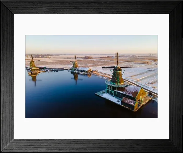 Framed Print : Snow at the Zaanse Schans windmill village during winter with snow landscape in the Netherlands Framed Print : Snow at the Zaanse Schans windmill village during winter with snow landscape in the Netherlands