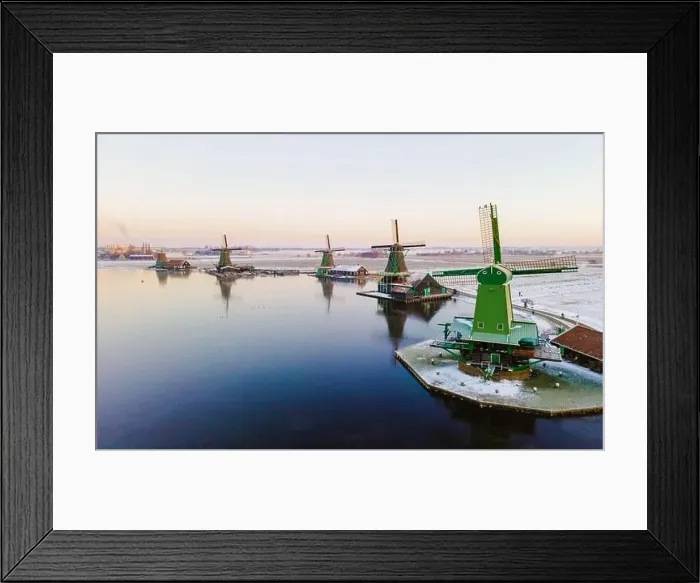 Framed Print : Drone view at the Zaanse Schans windmill village during winter with snow in the Netherlands