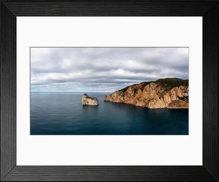 Framed Print : Panorama landscape of the cliffs and sea stacks at Porto Flavia on Sardinia Framed Print : Panorama landscape of the cliffs and sea stacks at Porto Flavia on Sardinia