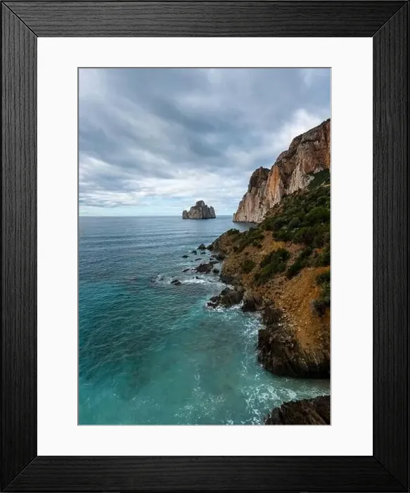 Framed Print : Vertical landscape of the cliffs and sea stacks at Porto Flavia on Sardinia Framed Print : Vertical landscape of the cliffs and sea stacks at Porto Flavia on Sardinia