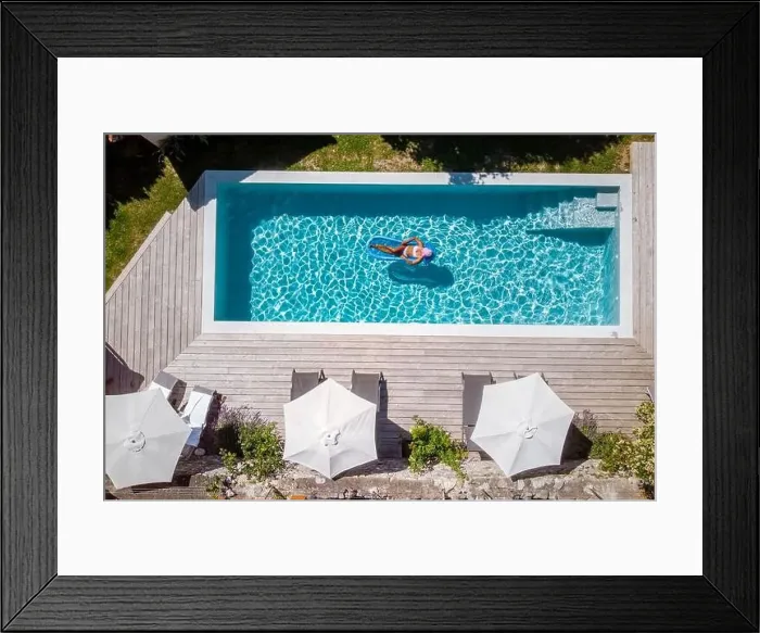 Framed Print : Two person swim in the pool at the hotel. View from above, couple men and women in swimming pool Framed Print : Two person swim in the pool at the hotel. View from above, couple men and women in swimming pool