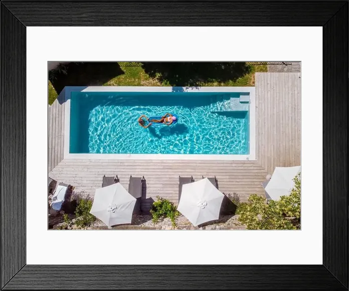 Framed Print : Two person swim in the pool at the hotel. View from above, couple men and women in swimming pool Framed Print : Two person swim in the pool at the hotel. View from above, couple men and women in swimming pool