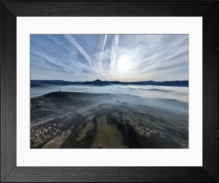 Framed Print : Aerial View. Flying over the high mountains in beautiful clouds Framed Print : Aerial View. Flying over the high mountains in beautiful clouds
