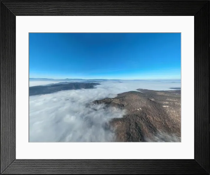 Framed Print : Aerial View. Flying over the high mountains in beautiful clouds Framed Print : Aerial View. Flying over the high mountains in beautiful clouds