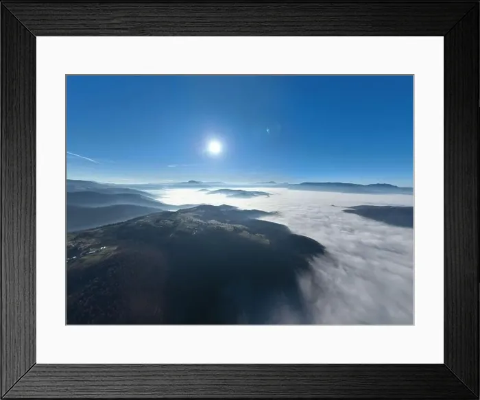 Framed Print : Aerial View. Flying over the high mountains in beautiful clouds Framed Print : Aerial View. Flying over the high mountains in beautiful clouds