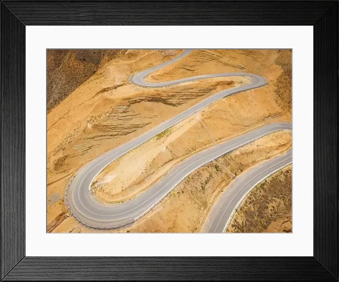 Framed Print : Top aerial view of snake curved road. Winding mountains road. View from above. Driveway serpentine with cars Framed Print : Top aerial view of snake curved road. Winding mountains road. View from above. Driveway serpentine with cars
