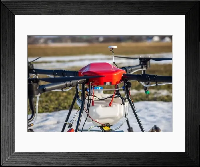 Framed Print : A beautiful red agrodron stands on the field Framed Print : A beautiful red agrodron stands on the field