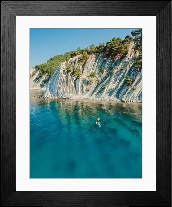 Framed Print : Man on stand up paddle board in blue sea. Surfer on SUP board in Mediterranean sea with mountain landscape. Aerial view Framed Print : Man on stand up paddle board in blue sea. Surfer on SUP board in Mediterranean sea with mountain landscape. Aerial view