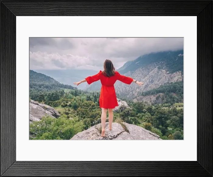 Framed Print : Romantic aerial photo of a girl in a red dress on top of a cliff admiring the view of a mountain gorge Framed Print : Romantic aerial photo of a girl in a red dress on top of a cliff admiring the view of a mountain gorge