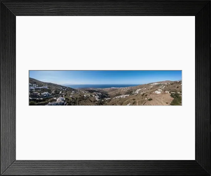 Framed Print : Tinos island, Cyclades Greece. Aerial panoramic view. Small villages with white houses on rocky land, blue sea and sky Framed Print : Tinos island, Cyclades Greece. Aerial panoramic view. Small villages with white houses on rocky land, blue sea and sky