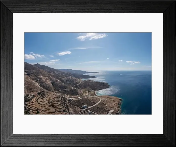 Framed Print : Tinos island, Cyclades Greece. Aerial panoramic drone view of rocky landscape and coast, rippled sea water, sunny day Framed Print : Tinos island, Cyclades Greece. Aerial panoramic drone view of rocky landscape and coast, rippled sea water, sunny day