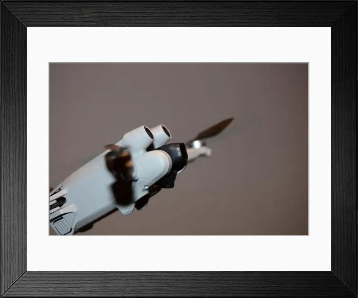 Framed Print : The drone copter flying with digital camera isolated on empty colorful background grey drones quad with sensors fly Framed Print : The drone copter flying with digital camera isolated on empty colorful background grey drones quad with sensors fly