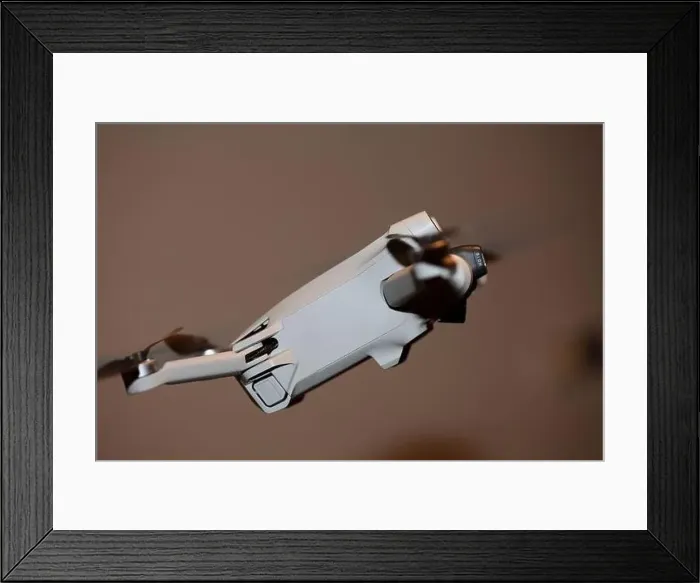 Framed Print : The drone copter flying with digital camera isolated on empty colorful background grey drones quad with sensors fly Framed Print : The drone copter flying with digital camera isolated on empty colorful background grey drones quad with sensors fly