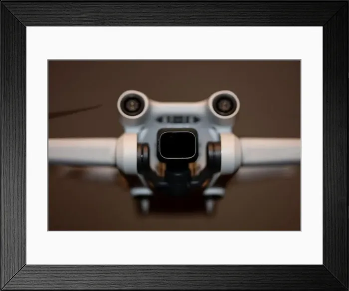 Framed Print : The drone copter flying with digital camera isolated on empty colorful background grey drones quad with sensors fly Framed Print : The drone copter flying with digital camera isolated on empty colorful background grey drones quad with sensors fly