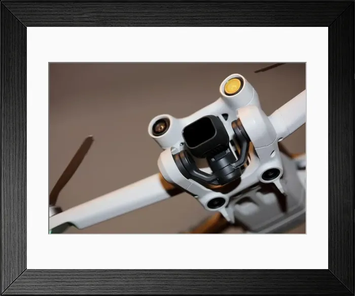 Framed Print : The drone copter flying with digital camera isolated on empty colorful background grey drones quad with sensors fly Framed Print : The drone copter flying with digital camera isolated on empty colorful background grey drones quad with sensors fly