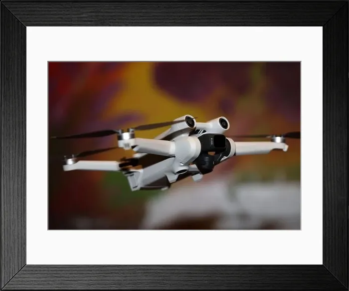 Framed Print : The drone copter flying with digital camera isolated on empty colorful background grey drones quad with sensors fly Framed Print : The drone copter flying with digital camera isolated on empty colorful background grey drones quad with sensors fly